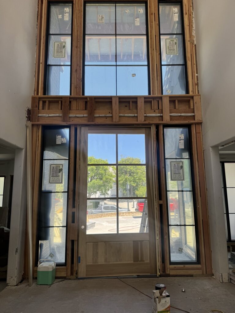 Custom entry drop zone with hooks and storage in a Calabasas home